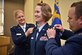 Newly promoted Lt. Col. Marta Davies, 932nd Airlift Wing Operations Group executive officer, has her father's silver oak leaves pinned on with assistance from Maj. Rachelle Amado and Capt. Brent Bettis, both with the 932nd Aeromedical Evacuation Squadron May 6, 2017, Scott Air Force Base, Illinois. (U.S. Air Force photo by Tech. Sgt. Christopher Parr)