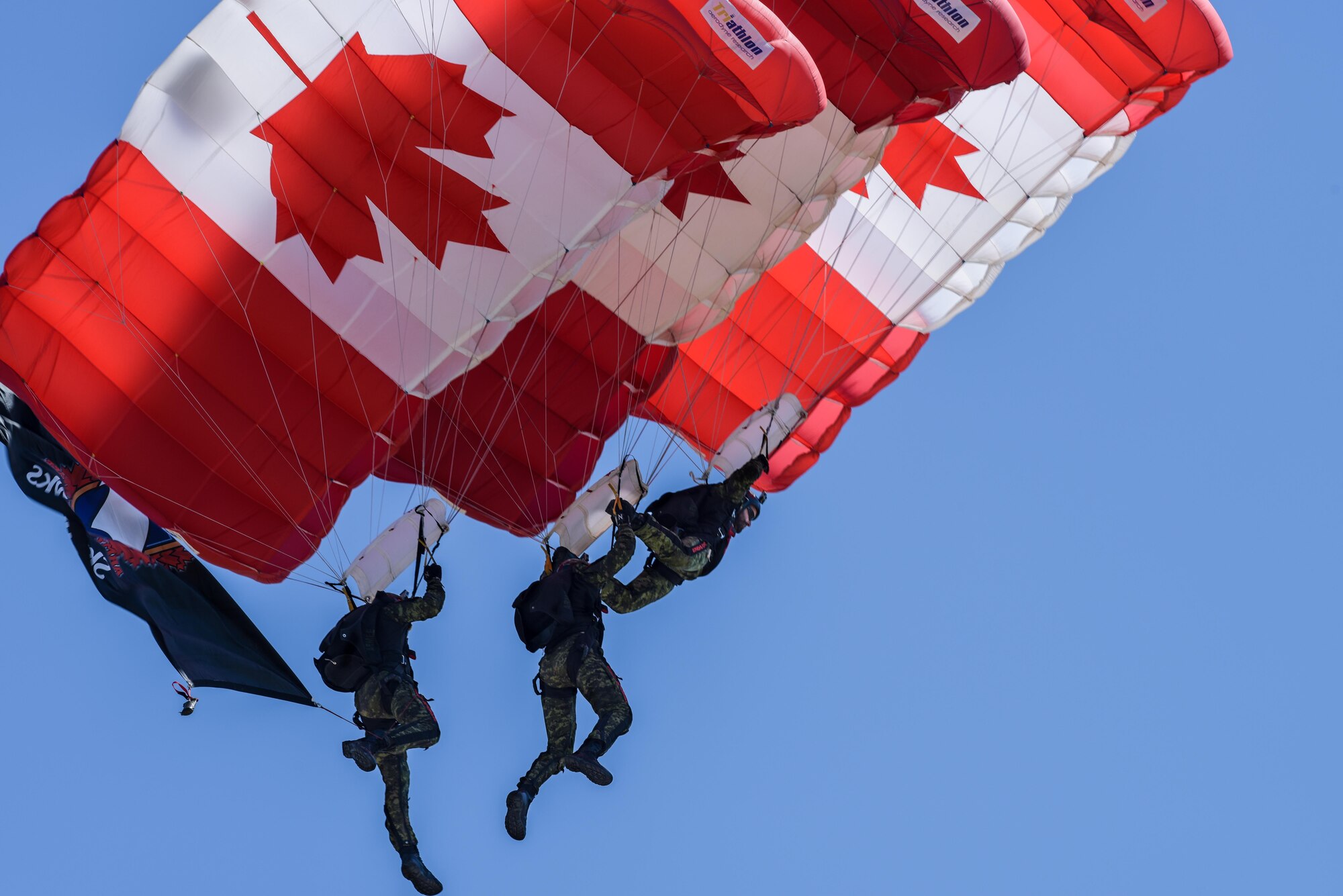 The Skyhawks, the Canadian armed forces parachute team, perform for spectators at the 2017 Barksdale Air Force Base Airshow, May 7. The Skyhawks have performed aerobatic stunts for more than 75 million spectators over 40 years. (U.S. Air Force photo/Senior Airman Mozer O. Da Cunha)