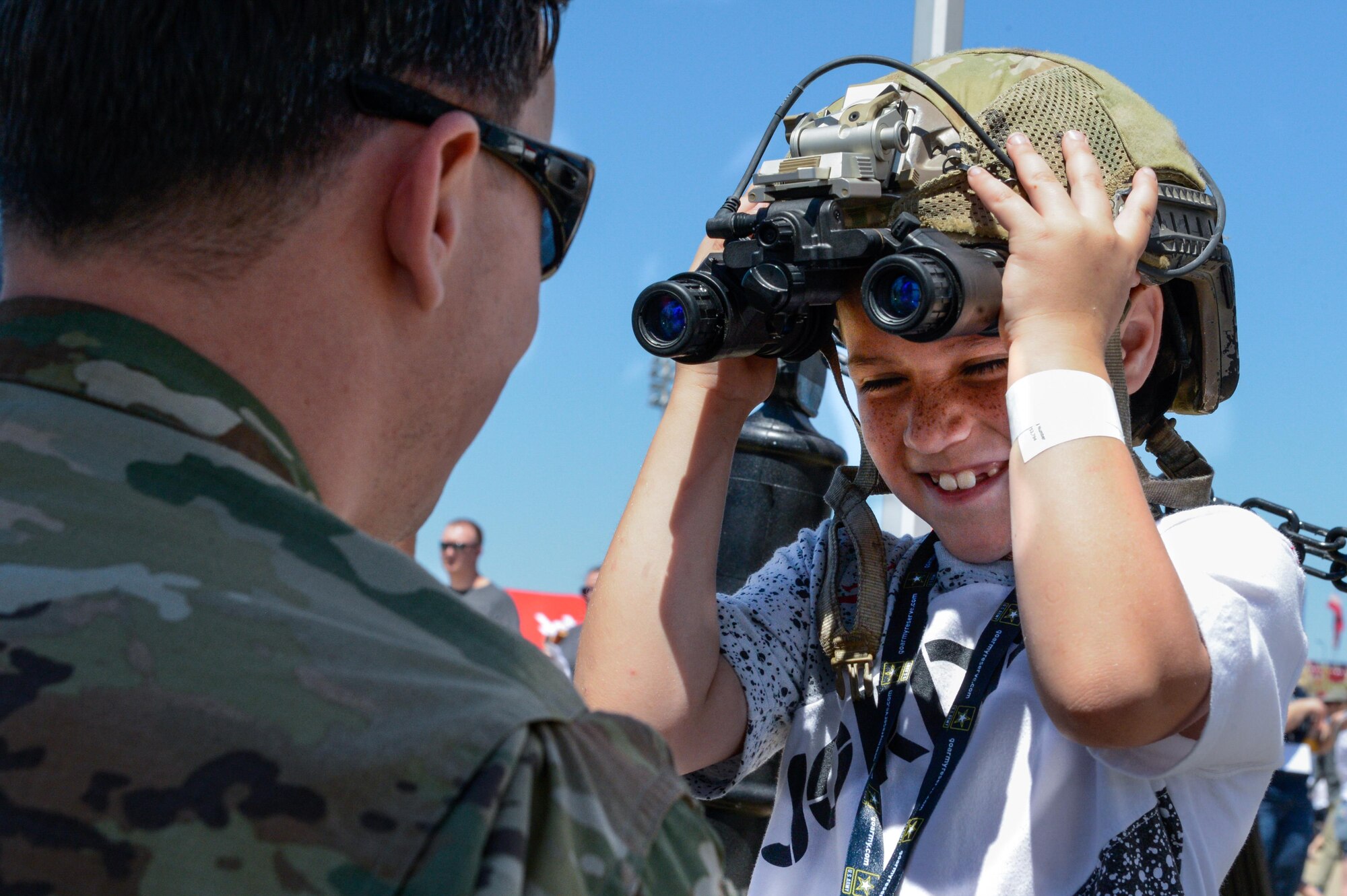 A Tactical Air Control Party Airman interacts with a child during the 2017 Barksdale Air Force Base Airshow, May 6. The show provided a variety of exhibits and demonstrations for the audience. (U.S. Air Force photo/Senior Airman Mozer O. Da Cunha)