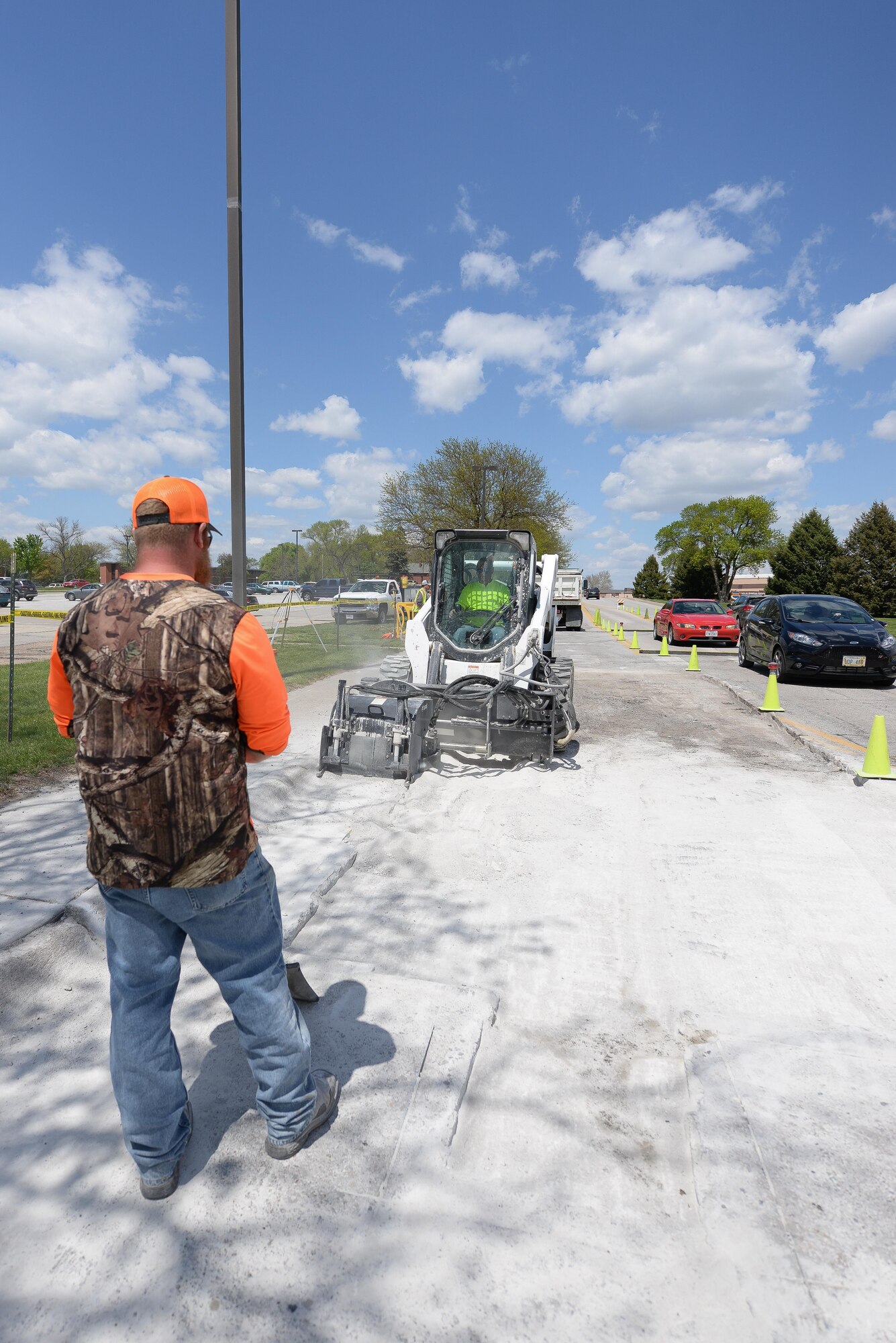 Members of the 55th Civil Engineer Squadron’s pavement and equipment team make repairs to SAC Blvd. May 3. Their 14-man crew, in the winter months, are also responsible for snow removal.  (U.S. Air Force photo by Zach Hada)