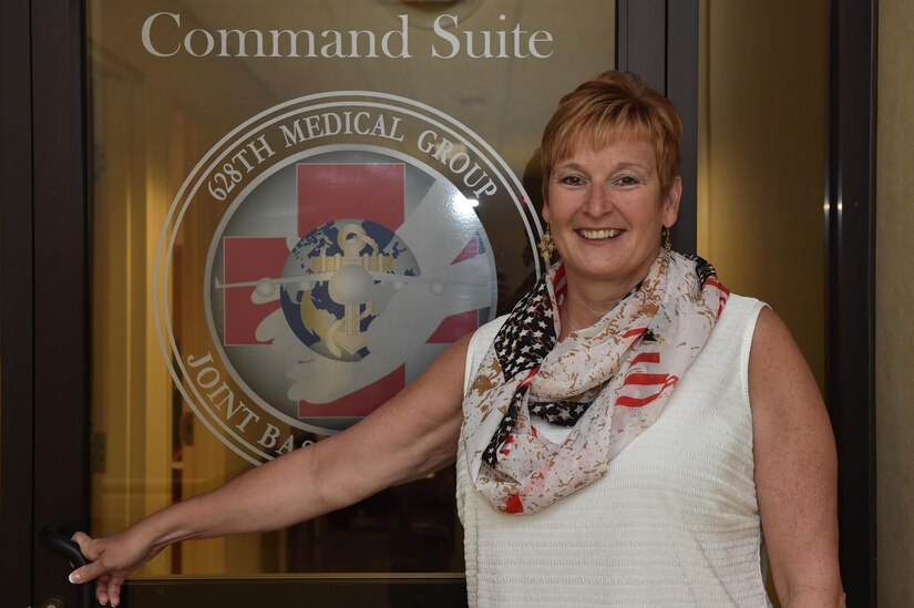 Retired U.S. Air Force Col. Judith Hughes poses outside of the command suite at the 628th Medical Group at Joint Base Charleston, S.C., May 3, 2017. Hughes served more than 27 years to the Air Force, retiring after serving as the 628th Medical Group commander. She currently serves on two board of directors; Palmetto Military Support Group and Charleston Research Institute.