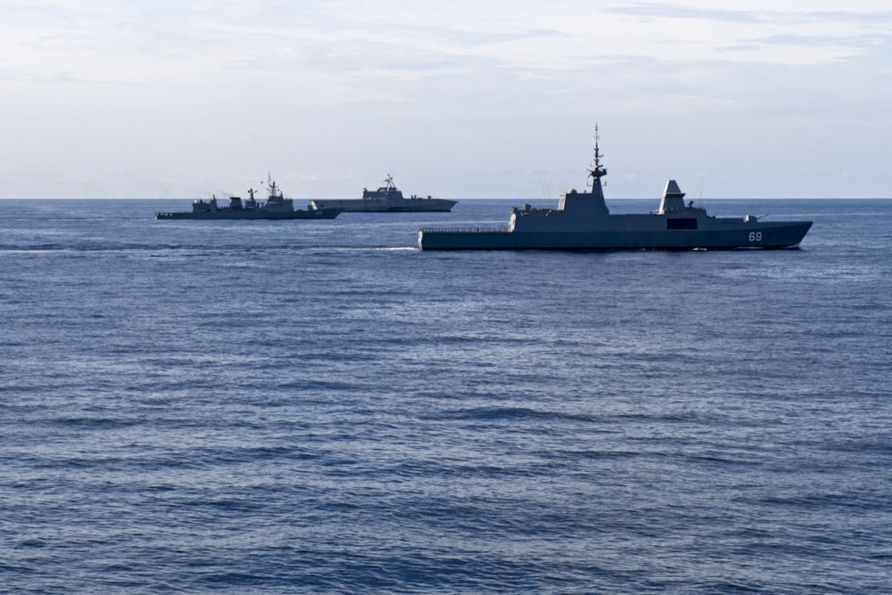 The Singapore navy ship RSS Intrepid, Royal Thai navy ship HTMS Naresuan, and littoral combat ship USS Coronado maneuver off the port side of the guided-missile destroyer USS Sterett during a divisional tactics exercise in support of the Cooperation Afloat Readiness and Training multilateral exercise in the South China Sea, May 11, 2017. CARAT is a series of annual maritime exercises aimed at strengthening partnerships and increasing interoperability through bilateral and multilateral engagements ashore and at sea. Navy photo by Petty Officer 1st Class Byron C. Linder