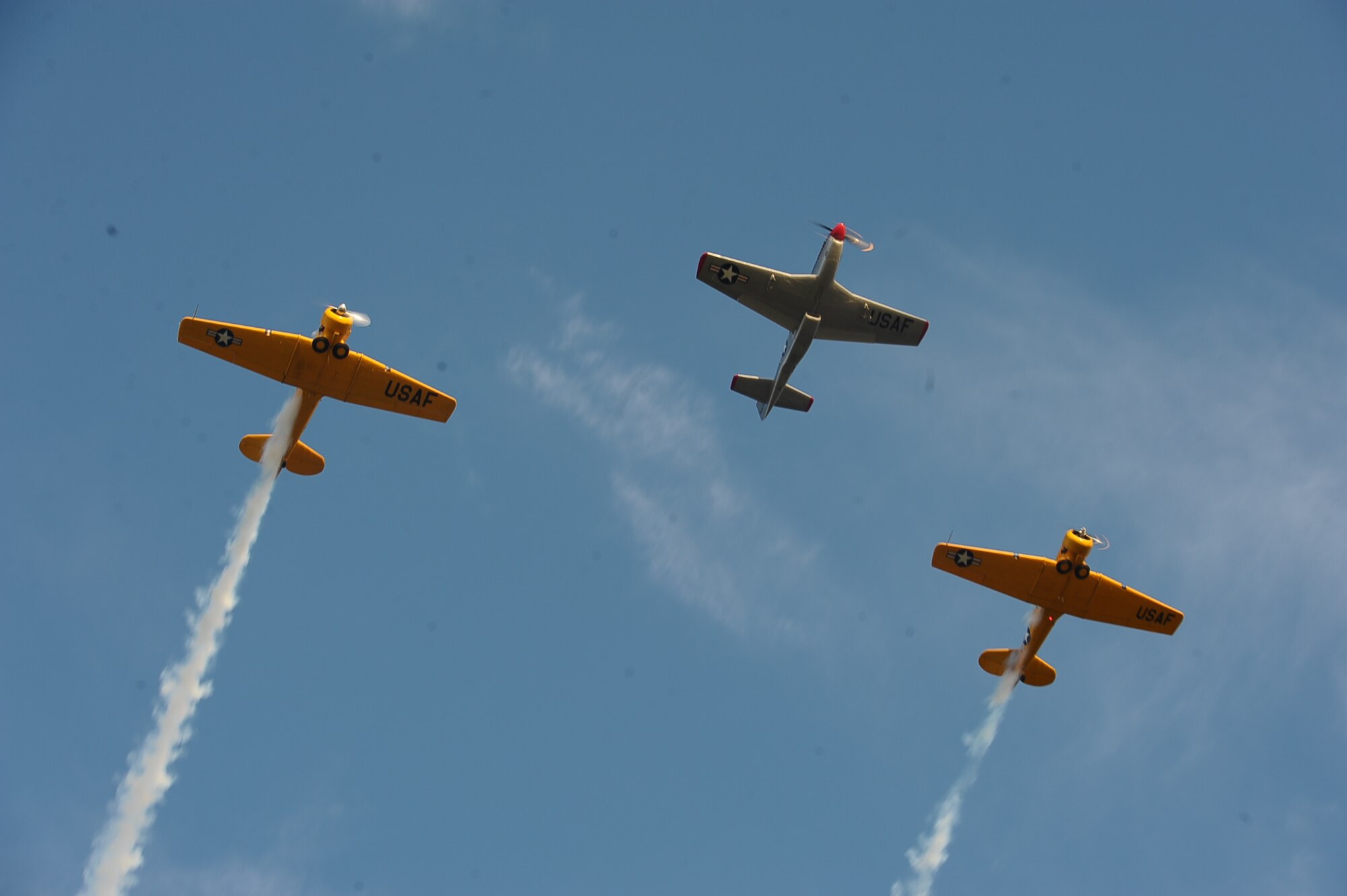 A formation of three AT-6 aircraft fly over Stennis Lock and Dam in Columbus, Mississippi. Fireworks on the Water, a free and open to the public event occurring July 1, 2017, is sponsored by Visit Columbus, U.S. Army Corps of Engineers, Lowndes County, the City of Columbus and Columbus Air Force Base to honor our nation’s independence. (U.S. Air Force photo by Senior Airman John Day)