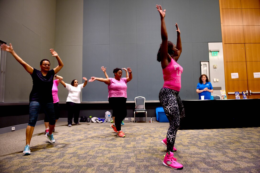 A local vendor host Zumba during the Evening Under the Stars event, May 10, 2017. The event featured massages, facials, manicures and several vendors to show thanks to spouses for their contributions to the military community. (U.S. Air Force photo/Staff Sgt. Areca T. Bell)