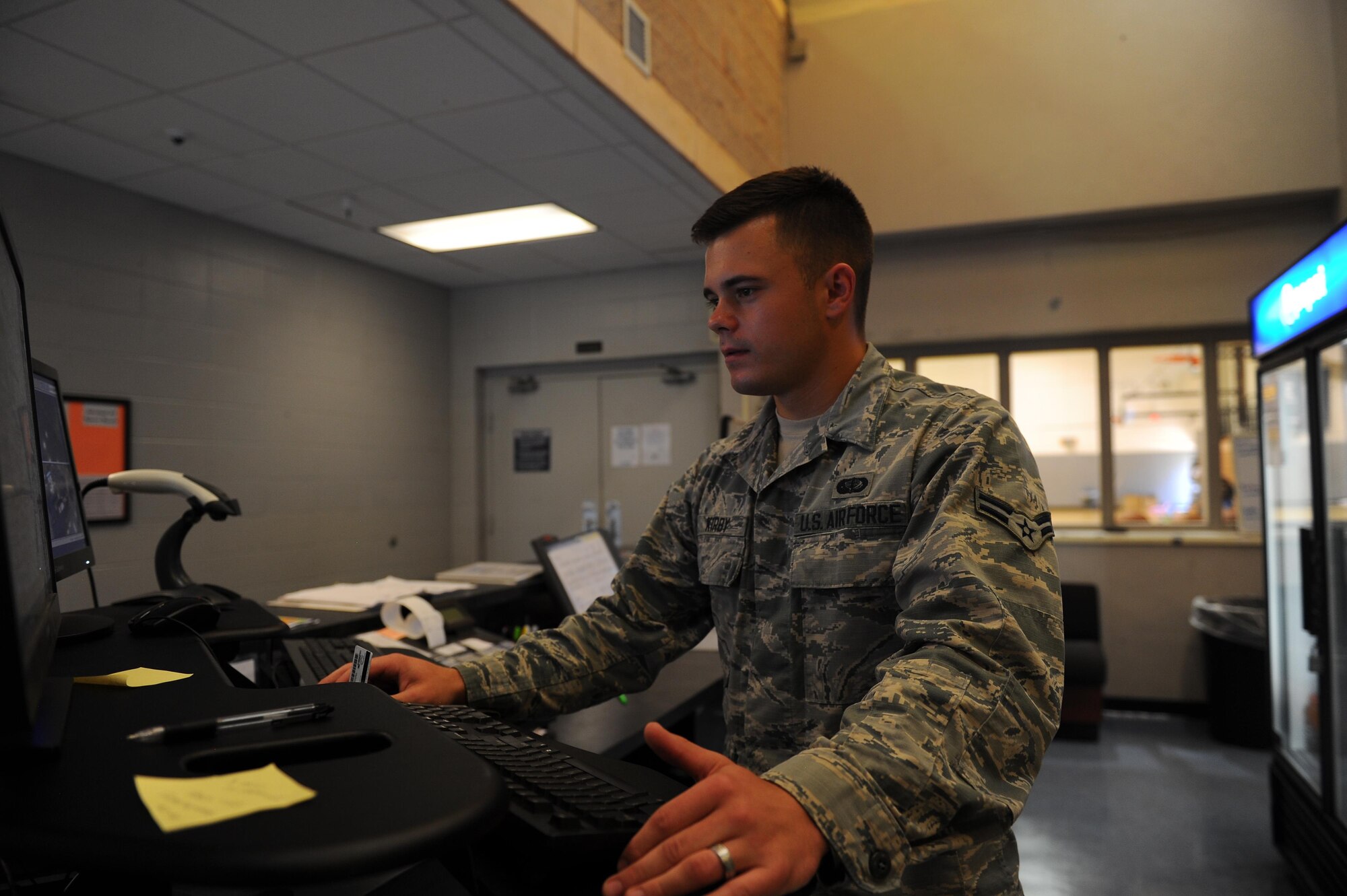 Airman 1st Class Zachary Kirby, a fitness specialist with 1st Special Operations Force Support Squadron, completes his daily tasks at the Aderholt Fitness Center, Hurlburt Field, Fla., May 10, 2017. Daily tasks for fitness specialists vary from cleaning, organizing and issuing equipment to instructing fitness classes. (U.S. Air Force photo by Airman 1st Class Isaac Guest)