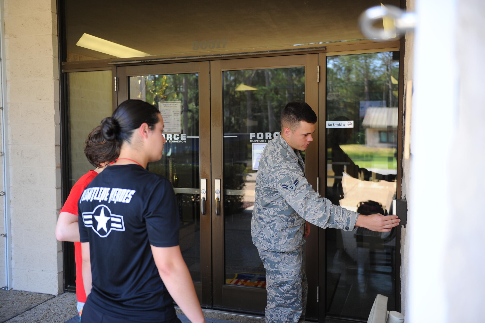 Airman 1st Class Zachary Kirby, a fitness specialist with 1st Special Operations Force Support Squadron, assits customers with after-hours access to the Aderholt Fitness Center, Hurlburt Field, Fla., May 10, 2017. Registering for after-hours access allows Team Hurlburt members to gain access to the fitness center, after business hours, using their common access card. (U.S. Air Force photo by Airman 1st Class Isaac O. Guest IV)