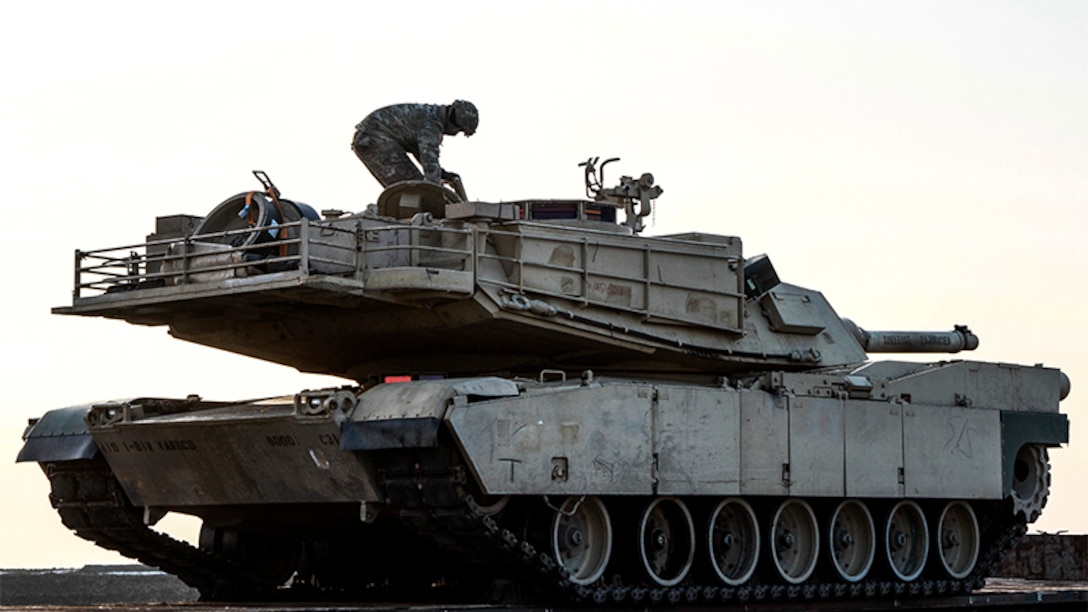 A soldier prepares to offload a vehicle.