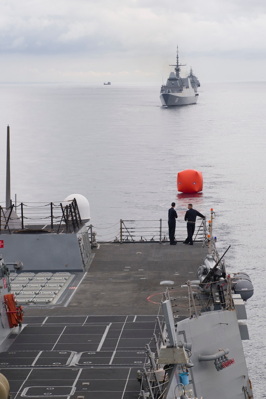 Sailors aboard Arleigh Burke-class guided-missile destroyer USS Sterett (DDG 104) deploy a "killer tomato" target in preparation for Sterett, Republic of Singapore ship RSS Intrepid (FFS 69), Royal Thai Navy ship HTMS Naresuan (FFG 421), and Independence-class littoral combat ship USS Coronado (LCS 4) to conduct a live-fire exercise in support of multilateral exercise Cooperation Afloat Readiness and Training (CARAT). CARAT is a series of annual maritime exercises aimed at strengthening partnerships and increasing interoperability through bilateral and multilateral engagements ashore and at sea. 