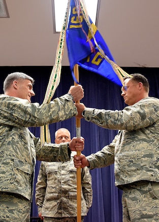 NEW CASLTE AIR NATIONAL GUARD BASE, Del.- Lt. Col. Lynn Robinson Jr., left, receives, the 166th Maintenance Group guidon from 166th Airlift Wing Commander Col. Robert Culcasi, right, during a command ceremony held on May 7, 2017. Robinson assumes the role of MXG group commander after leading the 166th Maintenance Squadron since September 2017. (U.S. Air National Guard photo by Tech. Sgt. Gwendolyn Blakley/ Released).