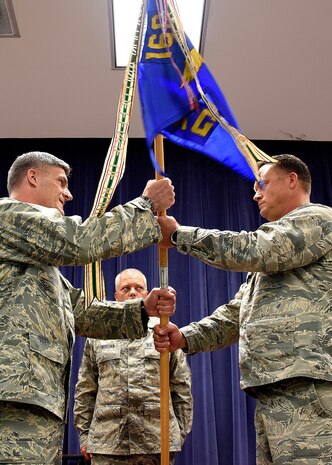 NEW CASLTE AIR NATIONAL GUARD BASE, Del.- Lt. Col. Lynn Robinson Jr., right, receives, the 166th Maintenance Group guidon from 166th Airlift Wing Commander Col. Robert Culcasi, left, during a command ceremony held on May 7, 2017. Robinson assumes the role of MXG group commander after leading the 166th Maintenance Squadron since September 2017. (U.S. Air National Guard photo by Tech. Sgt. Gwendolyn Blakley/ Released).