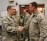 NEW CASLTE AIR NATIONAL GUARD BASE, Del.-  Lt. Col. Lynn Robinson Jr., incoming commander, 166th Maintenance Group, is congratulated on his assumption of command by Col. David Walker, assistant to the adjutant general- Air, Delaware National Guard, on May 7, 2017 following a change of command ceremony. (U.S. Air National Guard photo by Tech. Sgt. Gwendolyn Blakley/ Released).