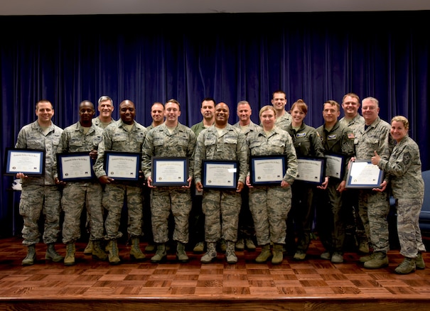 NEW CASLTE AIR NATIONAL GUARD BASE, Del. –   Members of the 166 Airlift Wing take a photo with the 166th Airlift Wing Commander Robert Culcasi, and the 166 Airlift Wing First Sergeant Shaune Peters on May 6, 2017. A Community College of the Air Force Graduation was held to recognize approximately 25 graduates on their achievement of obtaining associates degrees from the CCAF. (U.S. Air National Guard photo by Tech. Sgt. Gwendolyn Blakley/ Released).