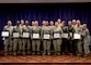 NEW CASLTE AIR NATIONAL GUARD BASE, Del. –   Members of the 166 Airlift Wing take a photo with the 166th Airlift Wing Commander Robert Culcasi, and the 166 Airlift Wing First Sergeant Shaune Peters on May 6, 2017. A Community College of the Air Force Graduation was held to recognize approximately 25 graduates on their achievement of obtaining associates degrees from the CCAF. (U.S. Air National Guard photo by Tech. Sgt. Gwendolyn Blakley/ Released).