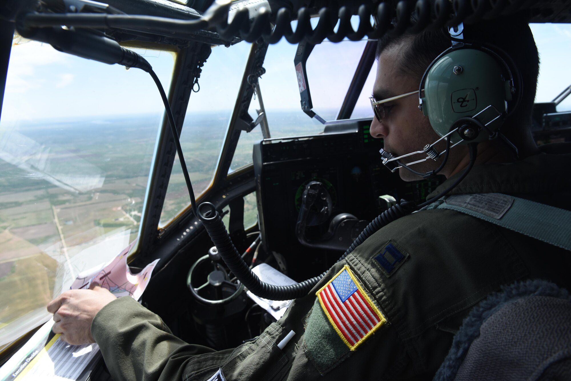 Capt. Omair Saeed, 29th Weapons Squadron weapons undergraduate student, flies a C-130J to an airfield near Dyess Air Force Base, Texas, May 2, 2017. The weapons school students conducted precise airdrops coordinated by a Special Tactics team, the Air Force’s ground special operations force. The STT also surveyed and controlled C-130J landings at an airfield after securing it, a capability that enables global access around the world. (U.S. Air Force photo by Staff Sgt. Kaylee Clark)
