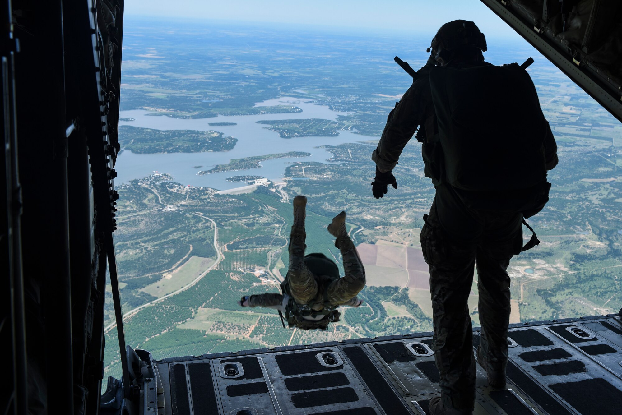 Combat controllers from the 24th Special Operation Wing, Hurlburt Field, Florida, conduct a High-Altitude Low-Opening military free fall jump May 2, 2017, at Dyess Air Force Base, Texas. Military free fall jumps are used to infiltrate behind enemy lines or into an area where an aircraft cannot land. Once infilled, the Special Tactics team accomplished a ground mission, using postured C-130J Super Hercules and B-1B Lancer aircraft to support the team with resupply and close air support. (U.S. Air Force photo by Staff Sgt. Kaylee Clark)