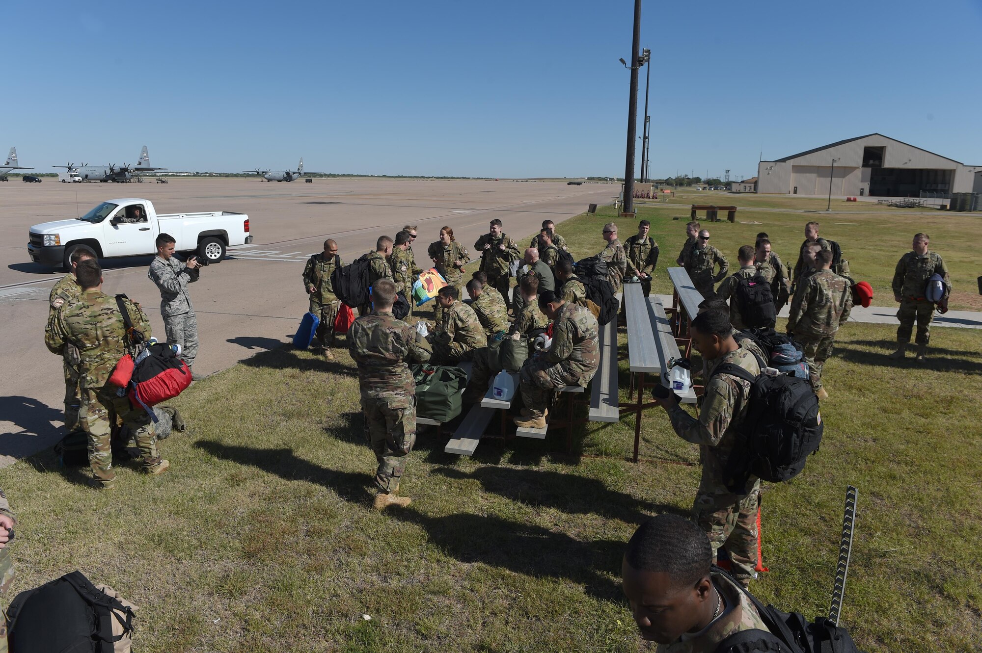 Members of the 40th Airlift Squadron wait next to the flight line before deploying at Dyess Air Force Base, Texas, May 6, 2017. The 40th AS deployed to Afghanistan in support of Operation Resolute Support. (Photo by U.S. Air Force Senior Airman Alexander Guerrero)