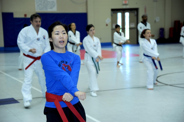 Sanyi Choi, a tae kwon do student and mother of a student, demonstrates her martial arts skill at the Redstone Arsenal youth center.