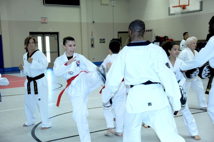 Tatiana Ayala, daughter of Carmen Perez and red belt tae kwon do student, delivers a power punch. Her mother is an employee with the U.S. Army Engineering and Support Center, Huntsville.