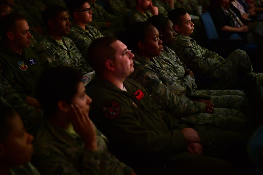 Airmen listen as Senior Master Sgt. Michael, 99th Air Base Wing superintendent community support, shares his personal experiences during the first Storytellers event May 10, 2017, at Creech Air Force Base, Nev. More than 200 Airmen attended the historic event to connect with others. (U.S. Air Force photo/Senior Airman Christian Clausen)