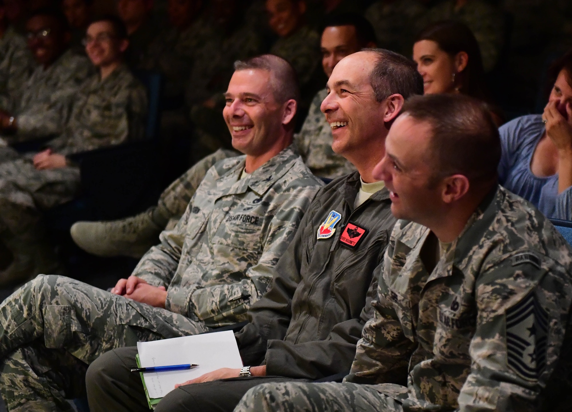 Nellis and Creech Air Force Base, Nev., leadership laugh as Tech. Sgt. Jimmy, 78th Attack Squadron intelligence analyst, shares his personal experiences during the first Storytellers event May 10, 2017, at Creech Air Force Base, Nev. Storytellers helps Airmen connect with others allowing them to relate to one another through stories of overcoming adversity. (U.S. Air Force photo/Senior Airman Christian Clausen)