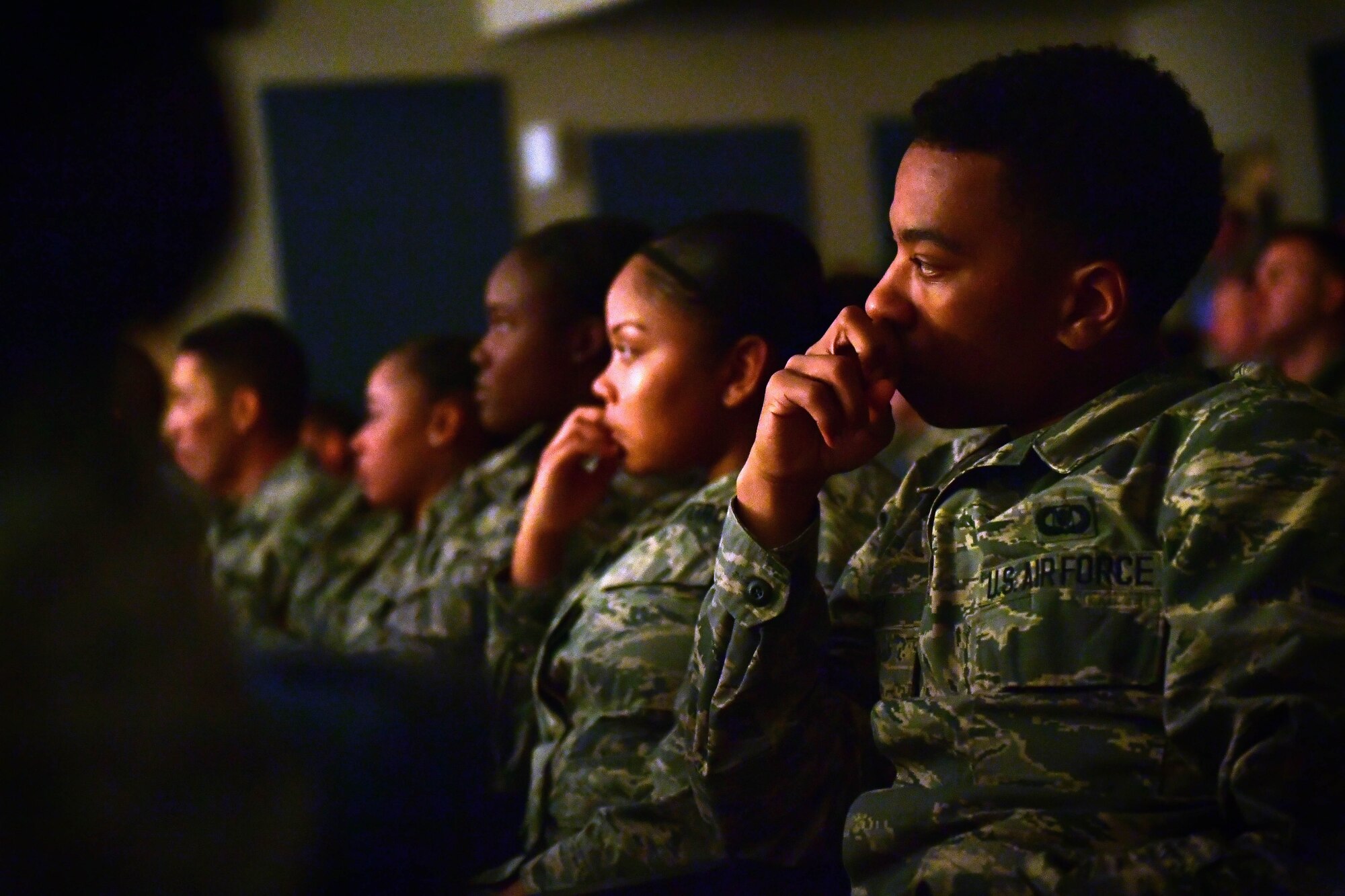 Airmen listen as others share their personal experiences during the first Storytellers event May 10, 2017, at Creech Air Force Base, Nev. This was the first Storytellers event to take place on Creech AFB and more than 200 Airmen attended to connect with others through stories of overcoming adversity. (U.S. Air Force photo/Senior Airman Christian Clausen)