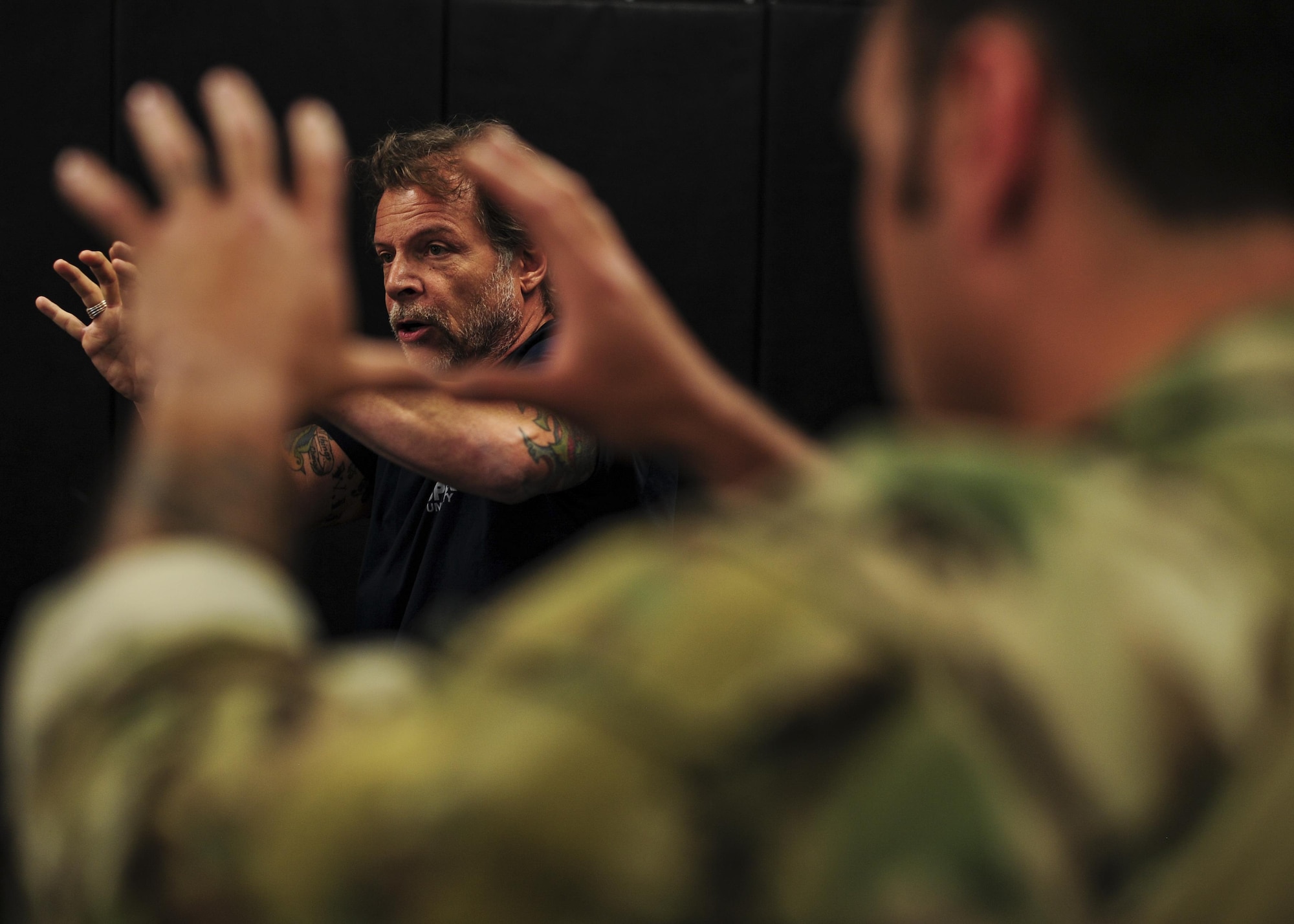 Tony Blauer, founder of Blauer Tactical Systems Inc., instructs Survival, Evasion, Resistance and Escape specialists during a week-long Spontaneous Protection Enabling Accelerated Response System course at Davis-Monthan Air Force Base, Ariz., April 27, 2017. The SPEAR System takes advantage of the human body’s startle/flinch mechanism to convert an aggressor’s attack into a tactical counter. (U.S. Air Force photo by Senior Airman Chris Drzazgowski)