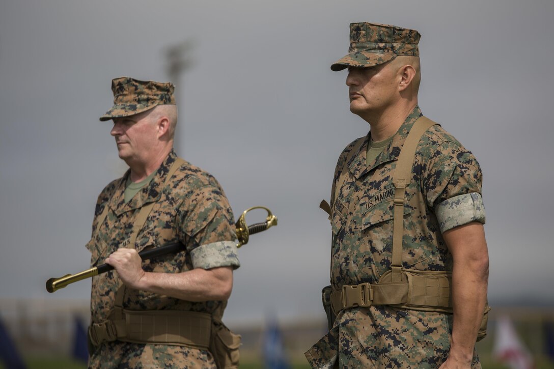 Sgt. Maj. Mario A. Marquez stands ready to receive the noncommissioned officer sword, symbolizing his appointment as III Marine Expeditionary Force sergeant major, during a ceremony at Camp Hansen, Okinawa, Japan, May 12, 2017. Sgt. Maj. Lee D. Bonar Jr. relinquished his post to Marquez and retired after enlisting out of Wheeling, West Virginia, 32 years ago. Marquez is a native of Lakewood, California.