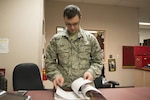 EIELSON AIR FORCE BASE, Alaska – U.S. Air Force Airman 1st Class Johnathan Pein, a 335th Aircraft Maintenance Unit aircrew flight equipment technician assigned to Seymour Johnson Air Force Base, N.C., checks a daily flying log during NORTHERN EDGE 2017 (NE17), at Eielson Air Force Base, Alaska. NE17 is Alaska’s premier joint training exercise designed to practice operations, techniques and procedures as well as enhance interoperability among the services. Thousands of participants from all the services, Airmen, Soldiers, Sailors, Marines and Coast Guardsmen from active duty, Reserve and National Guard units are involved. (U.S. Air Force photo/Staff Sgt. Ashley Nicole Taylor)