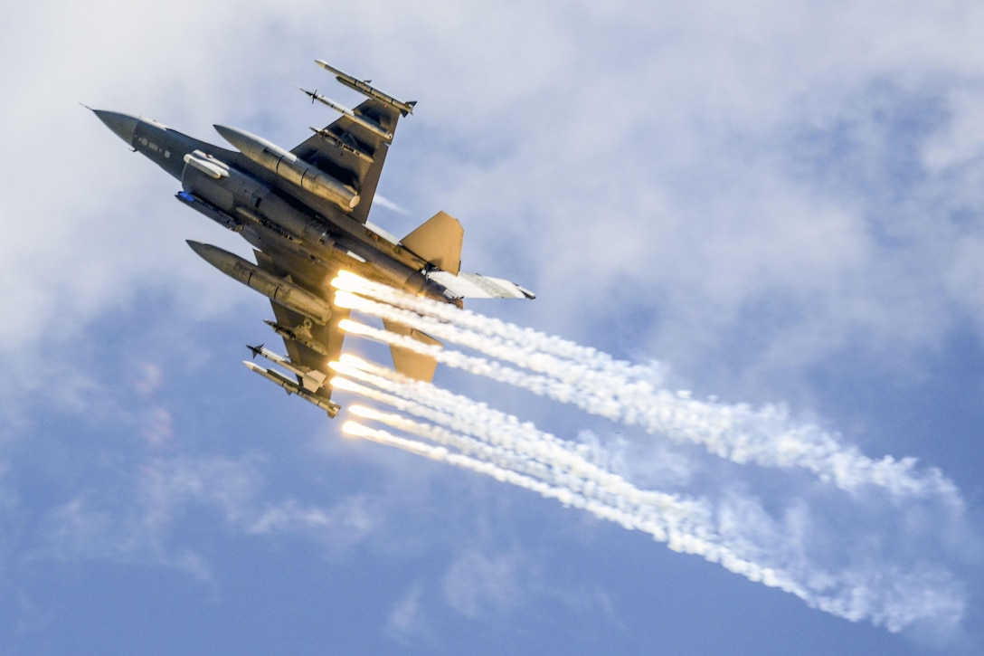 An Air Force F-16 Fighting Falcon deploys flares over McEntire Joint National Guard Base, S.C., May 6, 2017 during the South Carolina National Guard Air and Ground Expo. Air National Guard photo by Tech. Sgt. Jorge Intriago