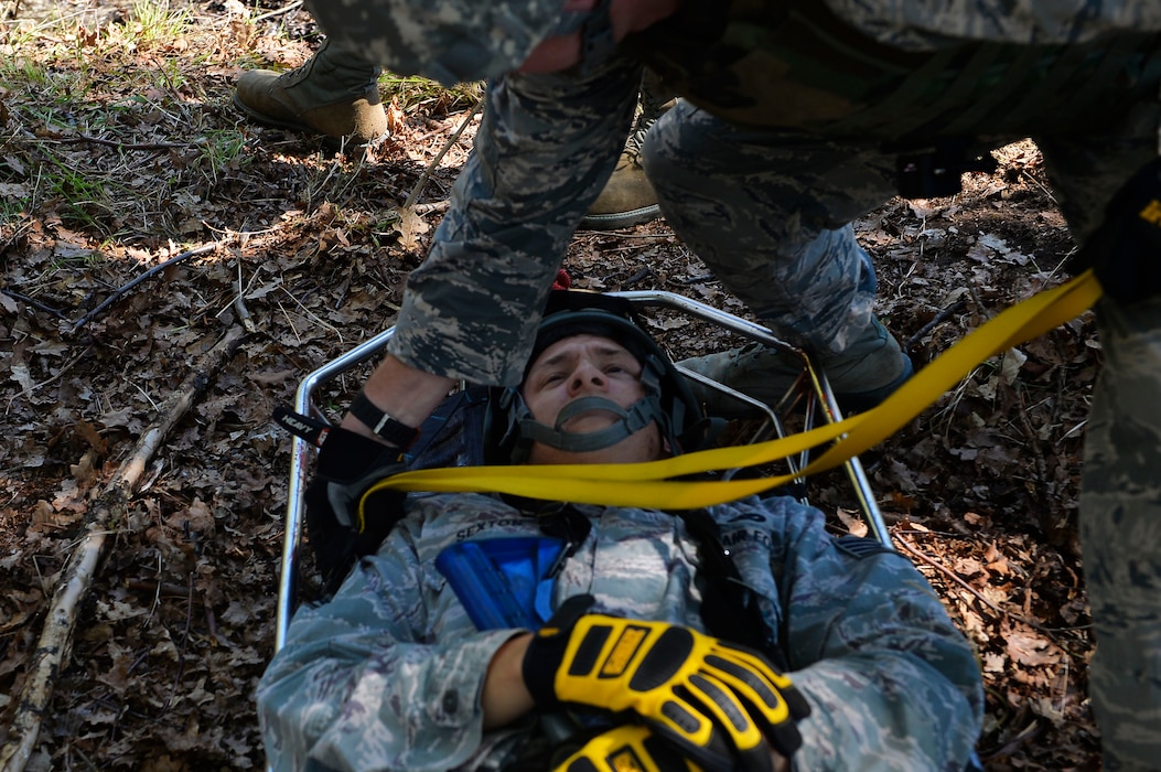 Staff Sgt. Shane Sexton, 185th Civil Engineer Squadron firefighter, lies in a gurney as he plays the role of a casualty during a Silver Flag exercise on Ramstein Air Base, Germany, May 10, 2017. Airmen from various Air National Guard units gathered on Ramstein to participate in Silver Flag, which is a contingency readiness exercise held at several Air Force bases around the world. (U.S. Air Force photo by Airman 1st Class Joshua Magbanua)