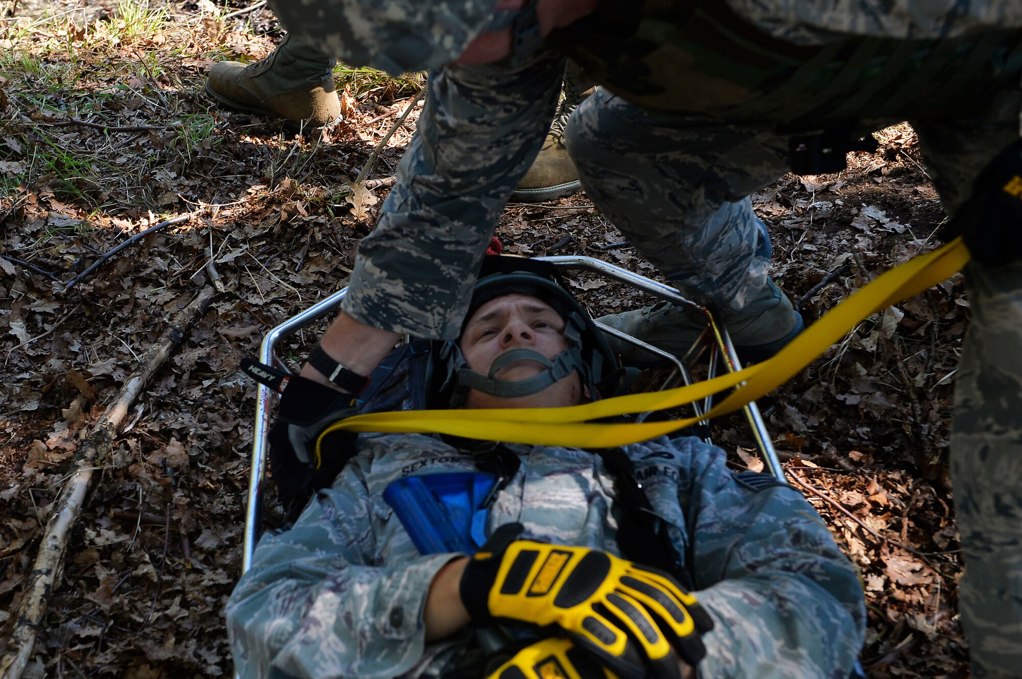 Staff Sgt. Shane Sexton, 185th Civil Engineer Squadron firefighter, lies in a gurney as he plays the role of a casualty during a Silver Flag exercise on Ramstein Air Base, Germany, May 10, 2017. Airmen from various Air National Guard units gathered on Ramstein to participate in Silver Flag, which is a contingency readiness exercise held at several Air Force bases around the world. (U.S. Air Force photo by Airman 1st Class Joshua Magbanua)