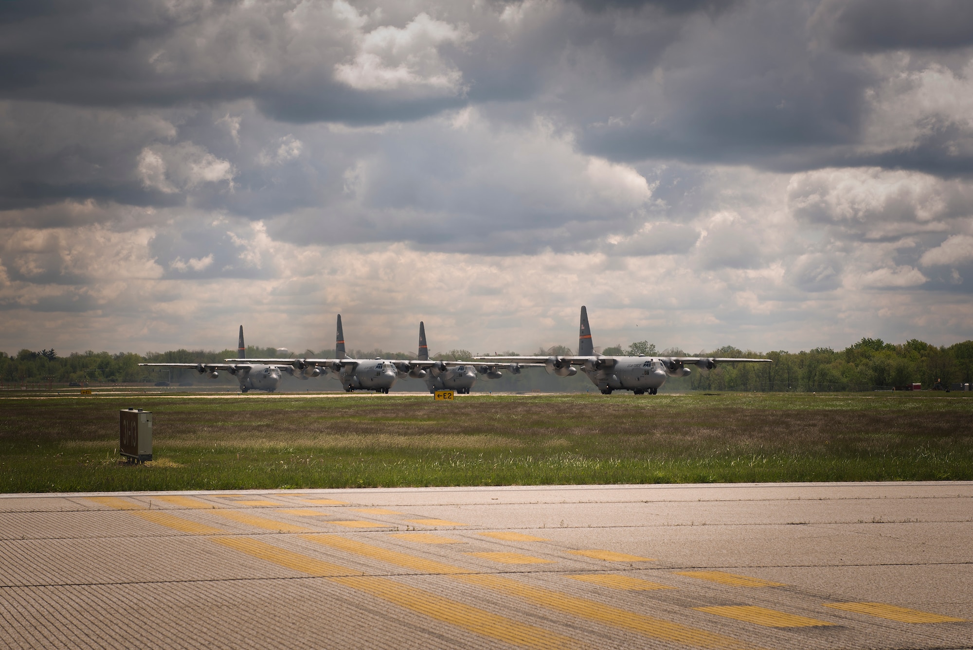 C-130H Hercules aircraft assigned to the 182nd Airlift Wing, Illinois Air National Guard, take off in a four-plane formation training during drill weekend in Peoria, Ill., May 6, 2017. The C-130 is capable of airdropping troops and equipment into hostile areas while operating in inclement terrain. (U.S. Air National Guard photo by Tech. Sgt. Lealan Buehrer)