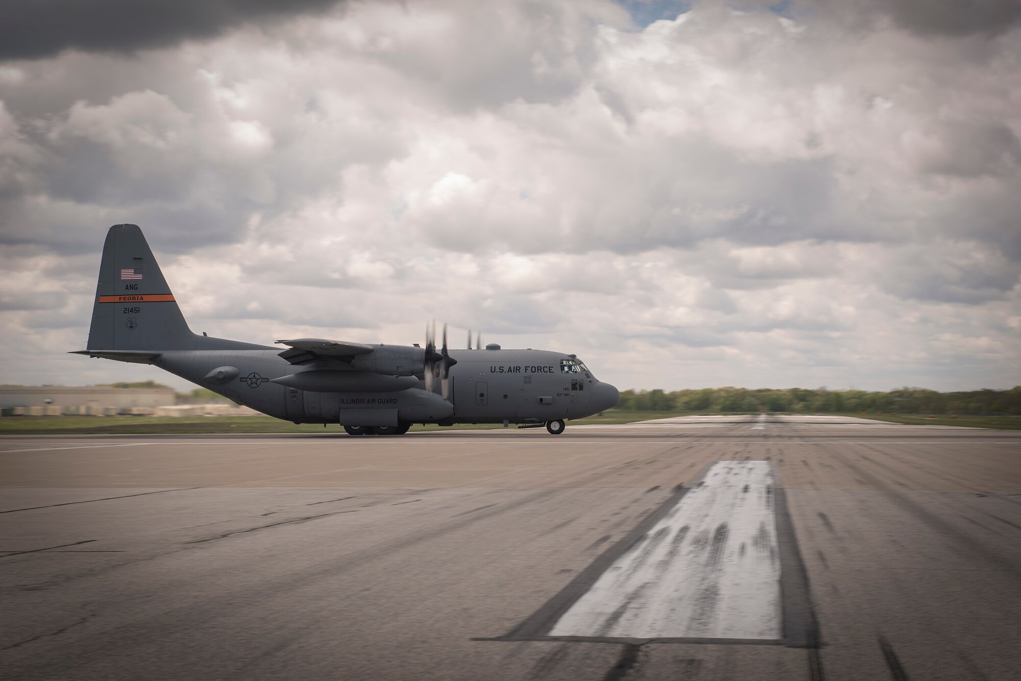 A C-130H Hercules aircraft assigned to the 182nd Airlift Wing, Illinois Air National Guard, takes off in a four-plane formation training during drill weekend in Peoria, Ill., May 6, 2017. The C-130 is capable of airdropping troops and equipment into hostile areas while operating in inclement terrain. (U.S. Air National Guard photo by Tech. Sgt. Lealan Buehrer)