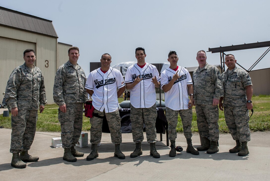 U.S. Air Force Staff Sgt. Andreous Madrid, Senior Airman Zachary Ward, Airman 1st Class Zackary Lau, the 36th Aircraft Maintenance Unit weapons load crew, Osan Air Base, are recognized as the winners of the 2017 annual load competition at Kunsan Air Base, Republic of Korea, May 13, 2017.  The 36th AMU beat out four other PACAF units and a ROKAF unit for the title. This was the first time Kunsan Air Base hosted a load crew competition that included members not stationed in Korea. (U.S. Air Force photo by Senior Airman Colville McFee/Released)  