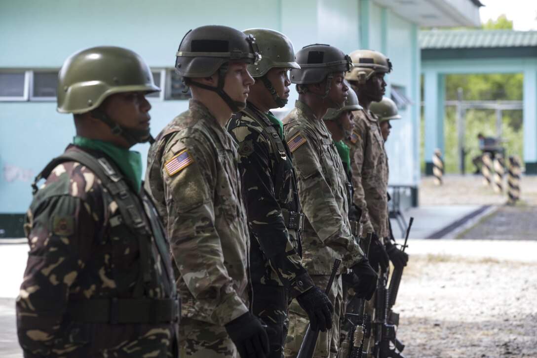 Philippine and U.S. service members stand ‘shoulder to shoulder’ during the opening ceremony of Balikatan 2017 at Fort Magsaysay in Santa Rosa, Nueva Ecija, May 8, 2017. Balikatan is an annual U.S.-Philippine bilateral military exercise focused on a variety of missions including humanitarian and disaster relief, counterterrorism, and other combined military operations.