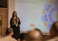 Basma Ismail, a volunteer briefer, shares her knowledge and experience of Ramadan with an audience of Sailors, Marines and Airmen at the 407th Air Expeditionary Group May 10, 2017, in Southwest Asia. During Ramadan, the traditional Islamic holy month, Muslims commit to daily fasting and charity mong other traditions. (U.S. Air Force photo by Staff Sgt. Alexander W. Riedel)