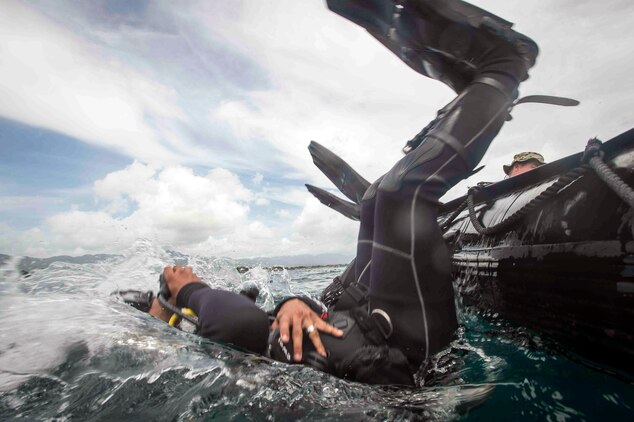 Philippine Sailors enter the water during an underwater construction demolition dive in support of Balikatan 2017 at Ipil Port in Ormoc City, Leyte, May 10, 2017. The demolition training prepares the U.S. military and Armed Forces of the Philippines to clear debris in ports and open up supply lines for victims of natural disasters and crises. Underwater demolition can help Philippine and U.S. forces provide humanitarian assistance and disaster relief operations from the sea to remote areas of the Philippines. 