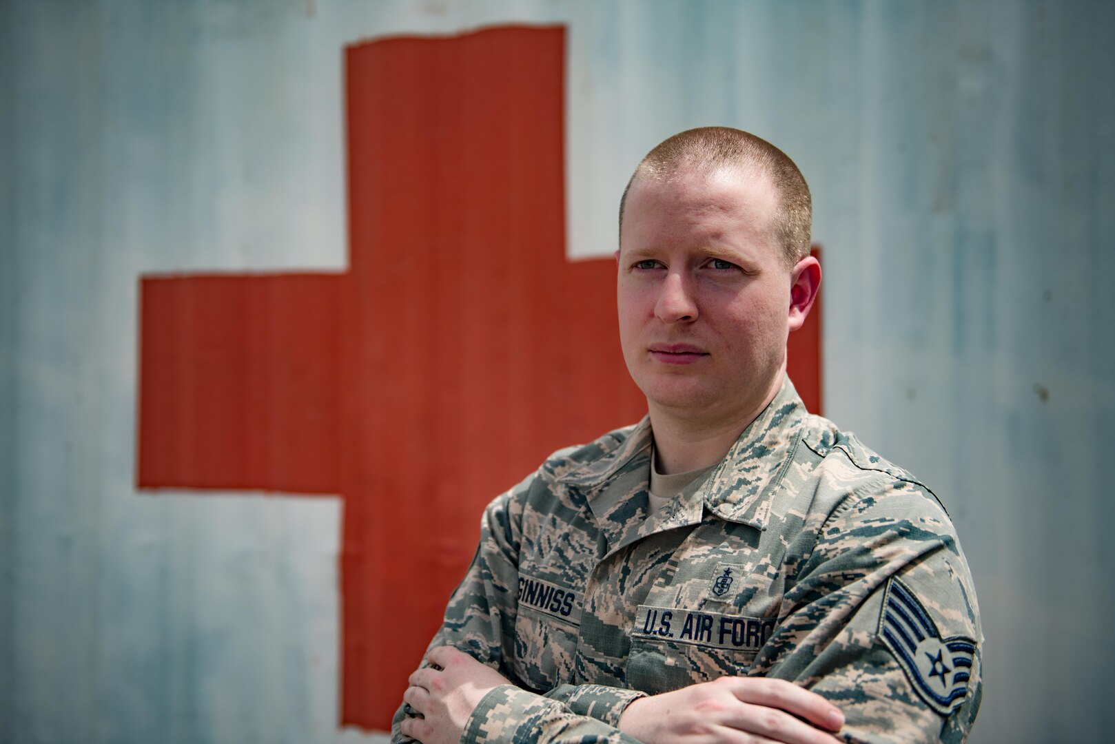 Staff Sgt. Ryan McGinniss, a biomedical equipment technician with the 332nd Expeditionary Medical Group, stands for a photo at the 407th Air Expeditionary Group May 9, 2017, in Southwest Asia. McGinnis is the only technician maintaining critical deployed medical equipment supporting joint and  coalition members on base. (U.S. Air Force photo by Staff Sgt. Alexander W. Riedel)