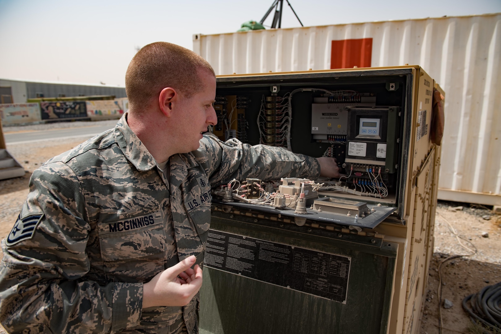 Staff Sgt. Ryan McGinniss, a biomedical equipment technician with the 332nd Expeditionary Medical Group, demonstrates troubleshooting procedures on a heating, ventilation and air conditioning unit May 9, 2017, in Southwest Asia. McGinnis is the facility mananger for the only remaining Expeditionary Medical Support System installation  supporting joint and  coalition members deployed to Operation Inherent Resolve. Part of his duties include ensuring consistent cooling and power for medical facilities, including refrigeration of crucial medications and immuniations.(U.S. Air Force photo by Staff Sgt. Alexander W. Riedel)