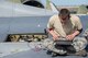 U.S. Air Force Senior Airman Corey Robison, a 35th Aircraft Maintenance Squadron electrical and environmental journeyman, works on a laptop at Misawa Air Base, Japan, May 3, 2017. Robison was troubleshooting the fuel flow indication to ensure wire continuity and all the wires were functioning properly. (U.S. Air Force photo by Senior Airman Brittany A. Chase)