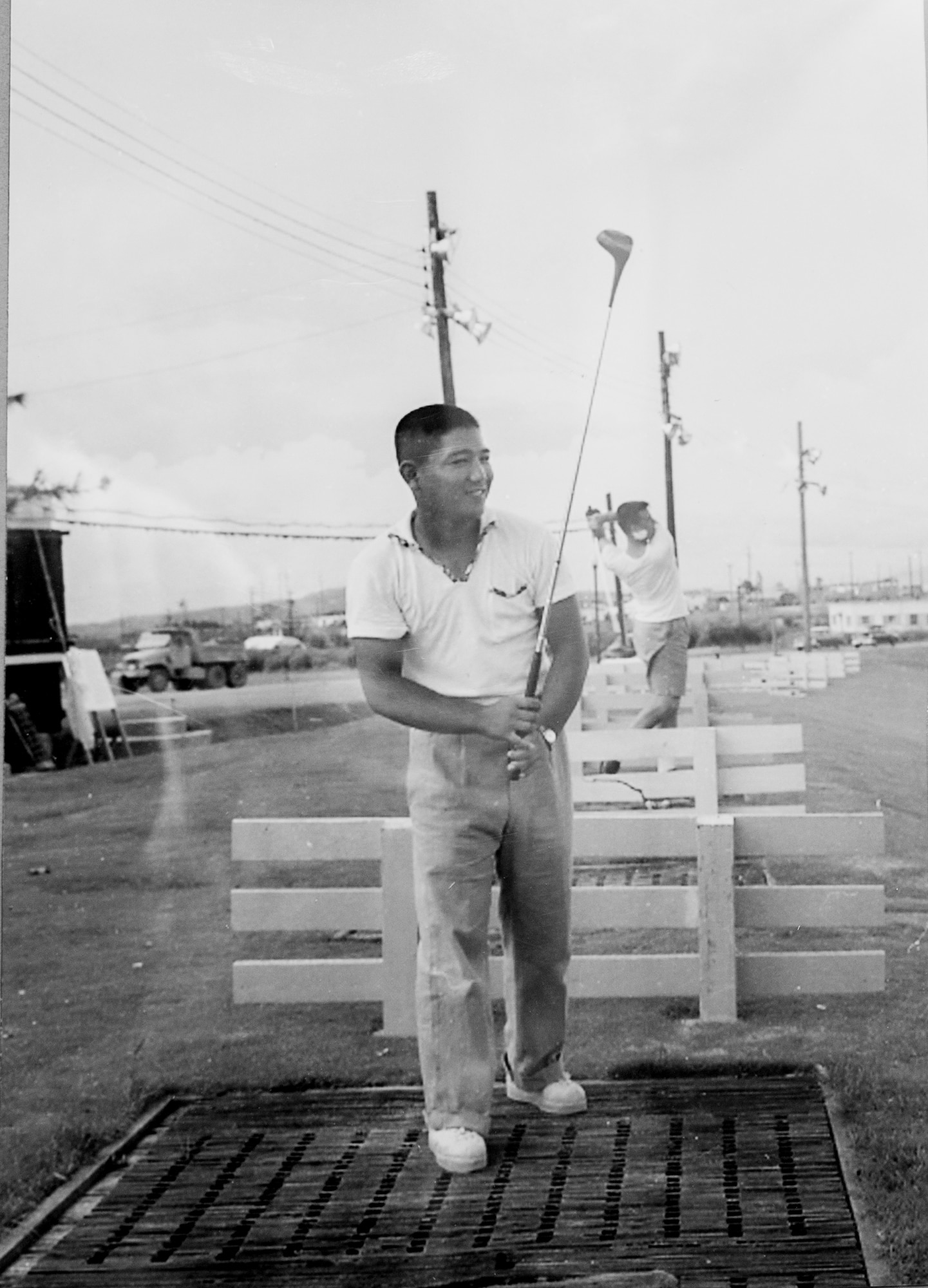 Tatsuo “Jimmy” Schwartz practices his golf at a driving range. Schwartz has maintained the golf courses of Kadena Air Base, Japan, for more than 30 years.