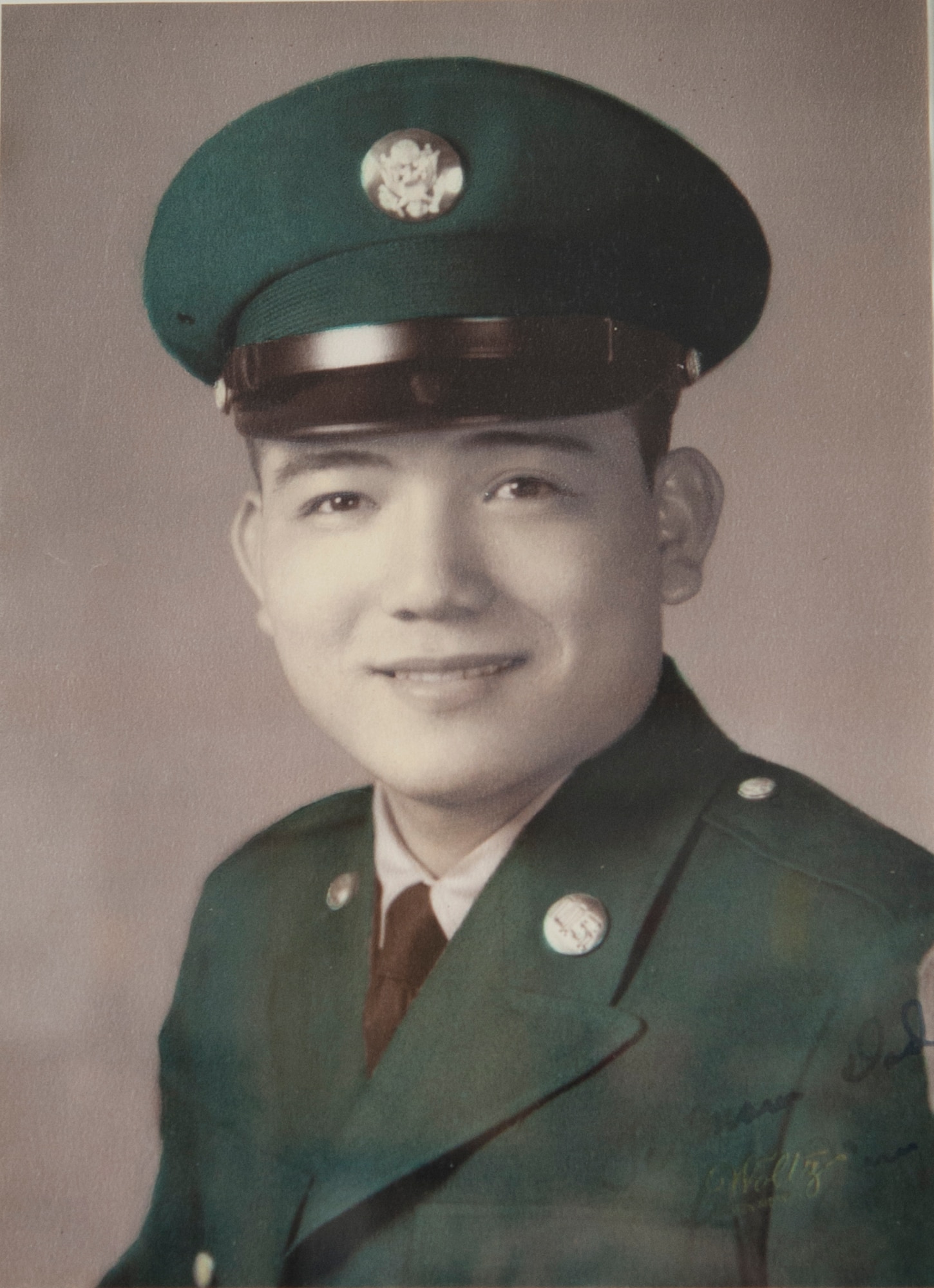 U.S. Army Private Tatsuo “Jimmy” Schwartz poses for an official photo in his dress uniform. Schwartz has worked for the Department of Defense for more than 50 years.