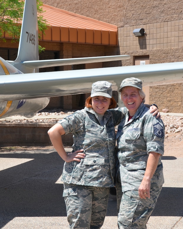 Staff Sgt. Nichole Jordan (left), aerospace medical technician for the 161st Air Refueling Wing Medical Group, and Master Sgt. Peggy Schmidt (right), a supply supervisor for the 161st Air Refueling Wing Logistics Readiness Squadron, pose in front of a 1947 F-84 Thunderjet aircraft static display, 12 May. In honor of mother’s day, both airmen express their love and appreciation for each other while serving their state and nation.