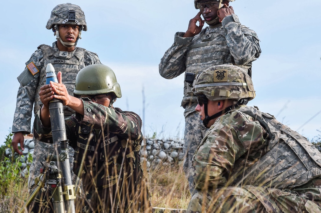 A Philippine Soldier prepares to fire off a mortar round alongside U.S. Soldiers with 1st Battalion, 23rd Infantry Regiment, during Balikatan 2017 at Fort Magsaysay in Santa Rosa, Nueva Ecija, May 14, 2017. By training together the Philippine and U.S. military build upon shared tactics, techniques, and procedures that enhance readiness and response capabilities to emerging threats. Balikatan is an annual U.S.-Philippine bilateral military exercise focused on a variety of missions, including humanitarian assistance and disaster relief, counterterrorism, and other combined military operations.