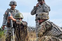 A Philippine Soldier prepares to fire off a mortar round alongside U.S. Soldiers with 1st Battalion, 23rd Infantry Regiment, during Balikatan 2017 at Fort Magsaysay in Santa Rosa, Nueva Ecija, May 14, 2017. By training together the Philippine and U.S. military build upon shared tactics, techniques, and procedures that enhance readiness and response capabilities to emerging threats. Balikatan is an annual U.S.-Philippine bilateral military exercise focused on a variety of missions, including humanitarian assistance and disaster relief, counterterrorism, and other combined military operations.