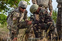 U.S. Army Pfc. Noah Ybarra, left, 1st Battalion, 23rd Infantry Regiment, assists a Philippine Soldier with changing the elevation of a mortar system during Balikatan 2017 at Fort Magsaysay in Santa Rosa, Nueva Ecija, May 14, 2017. By training together the Philippine and U.S. military build upon shared tactics, techniques, and procedures that enhance readiness and response capabilities to emerging threats. Balikatan is an annual U.S.-Philippine bilateral military exercise focused on a variety of missions, including humanitarian assistance and disaster relief, counterterrorism, and other combined military operations. 