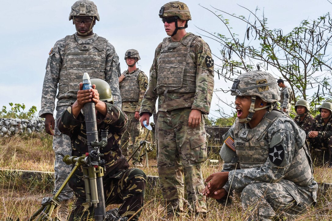 A Philippine Soldier prepares to fire a mortar round during Balikatan 2017 at Fort Magsaysay in Santa Rosa, Nueva Ecija, May 14, 2017. By training together the Philippine and U.S. military build upon shared tactics, techniques, and procedures that enhance readiness and response capabilities to emerging threats. Balikatan is an annual U.S.-Philippine bilateral military exercise focused on a variety of missions, including humanitarian assistance and disaster relief, counterterrorism, and other combined military operations.