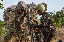 Philippine and U.S. Soldiers change the elevation of a mortar system during Balikatan 2017 at Fort Magsaysay in Santa Rosa, Nueva Ecija, May 14, 2017. By training together the Philippine and U.S. military build upon shared tactics, techniques, and procedures that enhance readiness and response capabilities to emerging threats. Balikatan is an annual U.S.-Philippine bilateral military exercise focused on a variety of missions, including humanitarian assistance and disaster relief, counterterrorism, and other combined military operations. 
