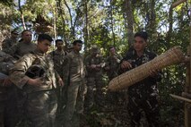 A Philippine Special Forces Soldier shows U.S. Soldiers, 1st Battalion, 23rd Infantry Regiment, a basket made from plant fibers during a subject matter expert exchange in support of Balikatan 2017 at Fort Magsaysay in Santa Rosa, Nueva Ecija, May 13, 2017. U.S. Soldiers trained with Philippine Special Forces to understand the Armed Forces of the Philippines’ techniques for operating in a jungle environment. Balikatan is an annual U.S.-Philippine bilateral military exercise focused on a variety of missions, including humanitarian and disaster relief, counterterrorism, and other combined military operations. 