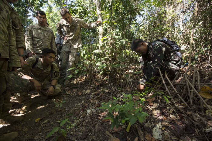 A Philippine Special Forces Soldier explains a snare trap to U.S. Soldiers, 1st Battalion, 23rd Infantry Regiment, during a subject matter expert exchange in support of Balikatan 2017 at Fort Magsaysay in Santa Rosa, Nueva Ecija, May 13, 2017. U.S. Soldiers trained with Philippine Special Forces to understand the Armed Forces of the Philippines’ techniques for operating in a jungle environment. Balikatan is an annual U.S.-Philippine bilateral military exercise focused on a variety of missions including, humanitarian and disaster relief, counterterrorism, and other combined military operations. 